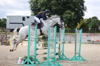 Charlotte Sheppard commands the win in the Equissage British Novice Second Round at Dorset Showground